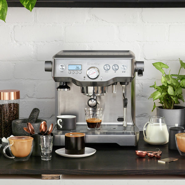 Breville the Dual Boiler Espresso Machine on Countertop with Coffee & milk